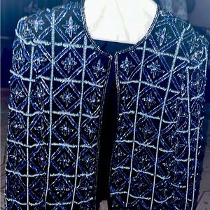 Jacket black background with blue silver sequins. Long sleeves